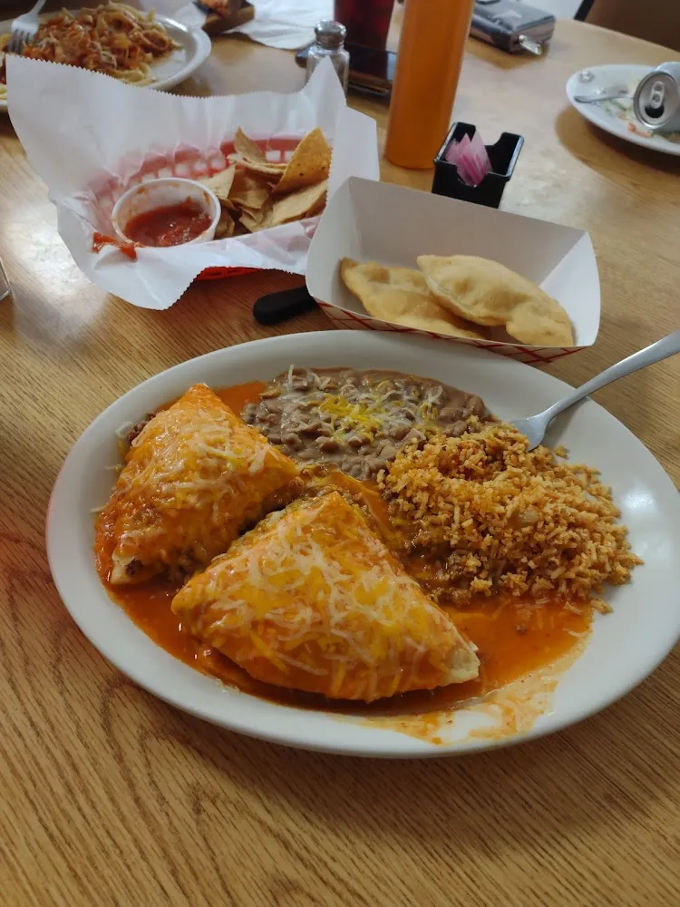 3 Stuffed Sopapillas All Beef Smothered in Red Chile & Beans and Rice